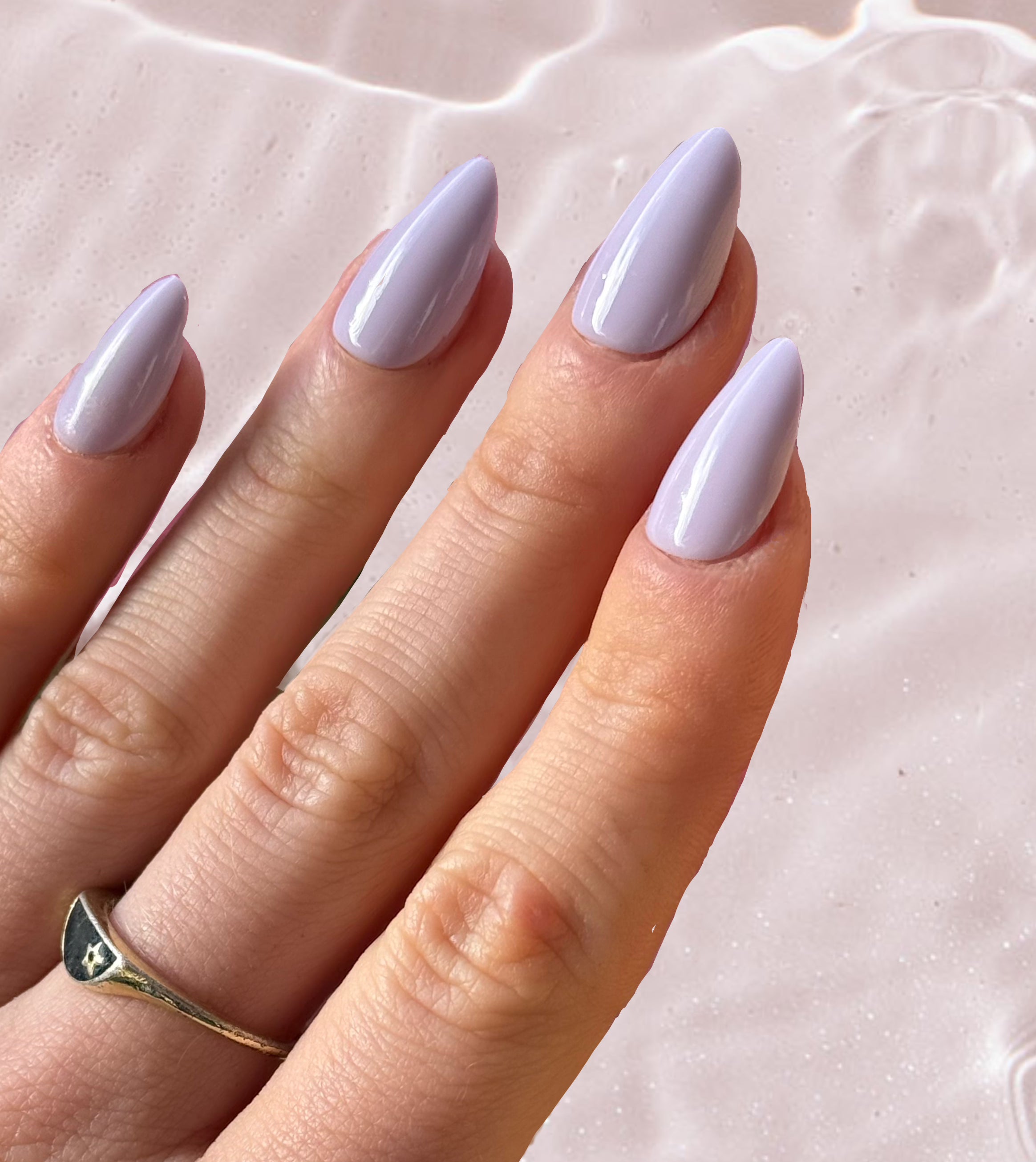 Flat View of Hand wearing Sugar Tips Lavender Milk Soft Lilac Glossy Almond Press on Nails.