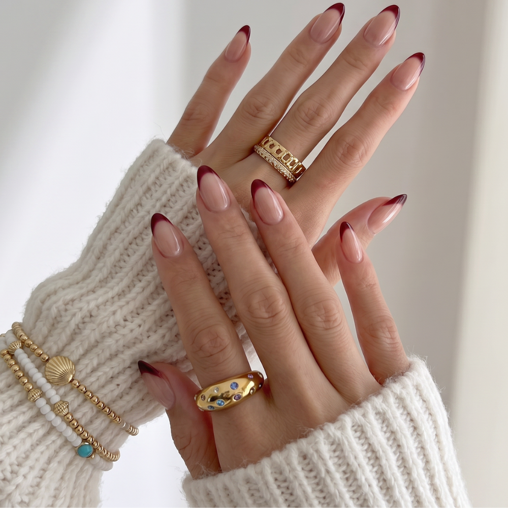 Dark red French tip press-on nails by Sugar Tips, available Australia wide