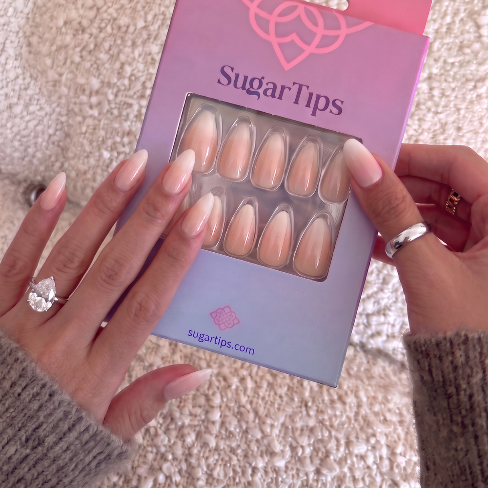 Hands showcasing Sugar Tips Press On Nails. 