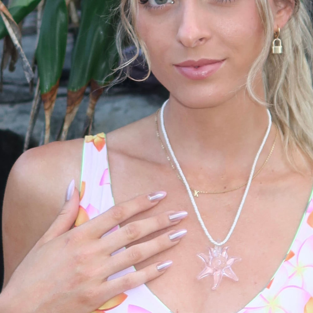 Girl showing off long almond ombre press on nails