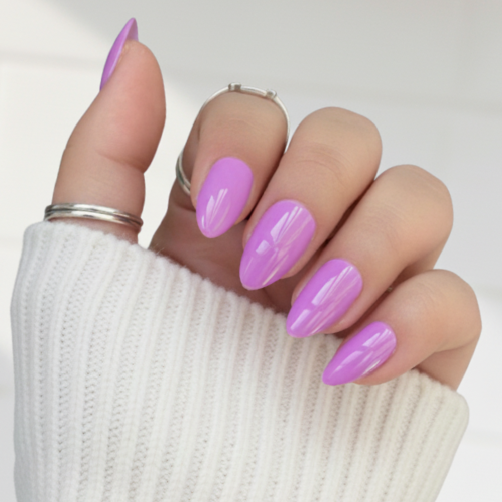 Hand wearing Sugar Tips Sugar Baby Glossy Lavender Almond Press On Nails.