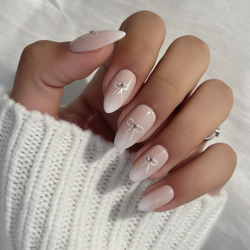 Sugar Tips Bow Down Soft Pink Ombre with Rhinestone Bows Almond press-on nails.